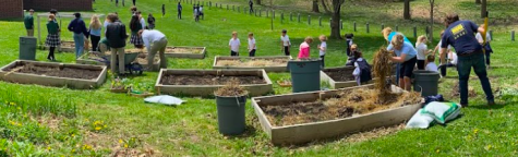 Students from Early Years, Middle School, and Upper School all work together to prepare the garden beds in early May. 