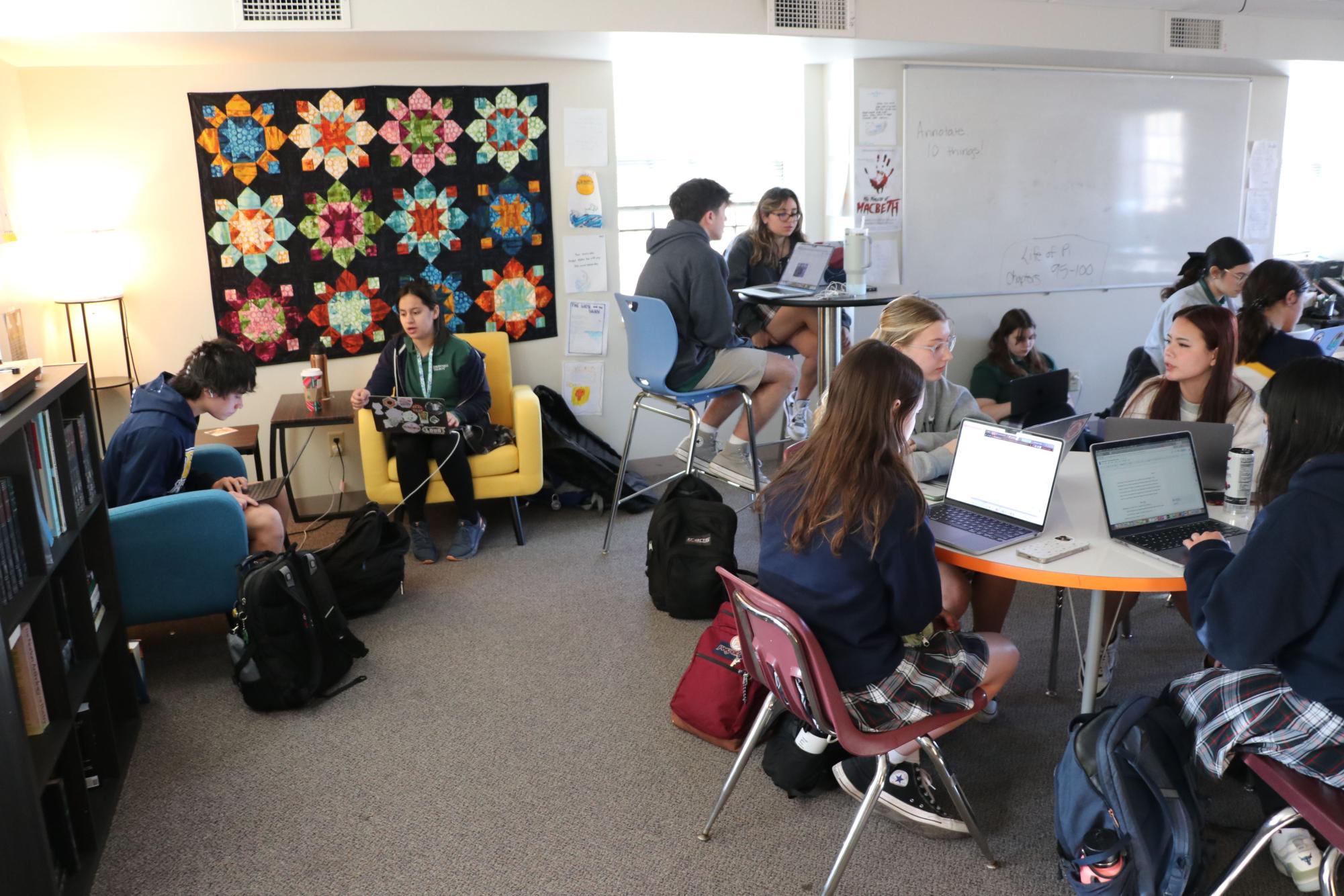 Juniors and seniors from NHS work with freshmen in the Writing Center. 