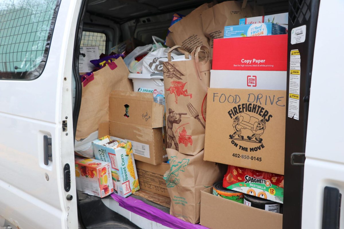 The fall food drive was so successful that donations overflowed from Completely Kid's transport van into a second vehicle.