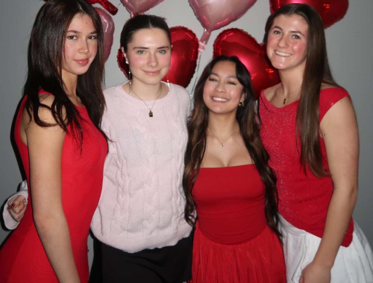 Elliot Clark, Teagan McCallister, Angela Hensley, and Abbi Gibbs showing bright red and light pink Valentine's colors!