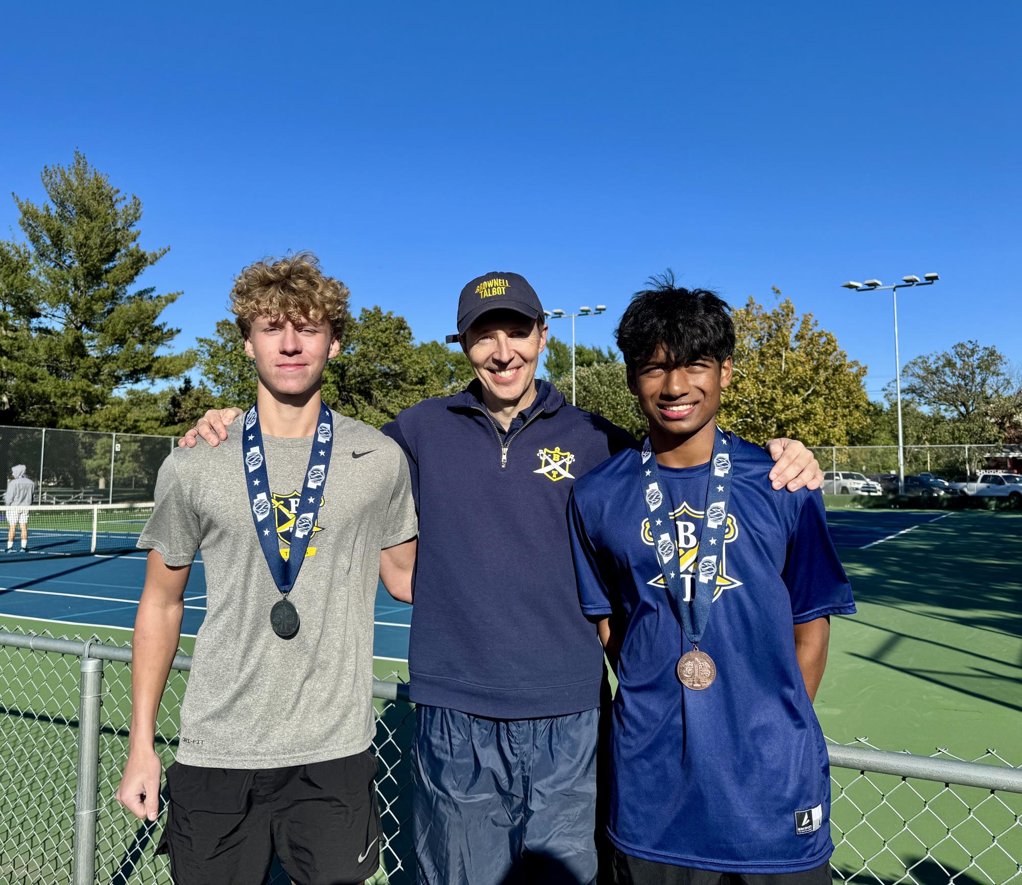 Ivan and Rishi with Coach Mark Smith after medaling at States. (2025)